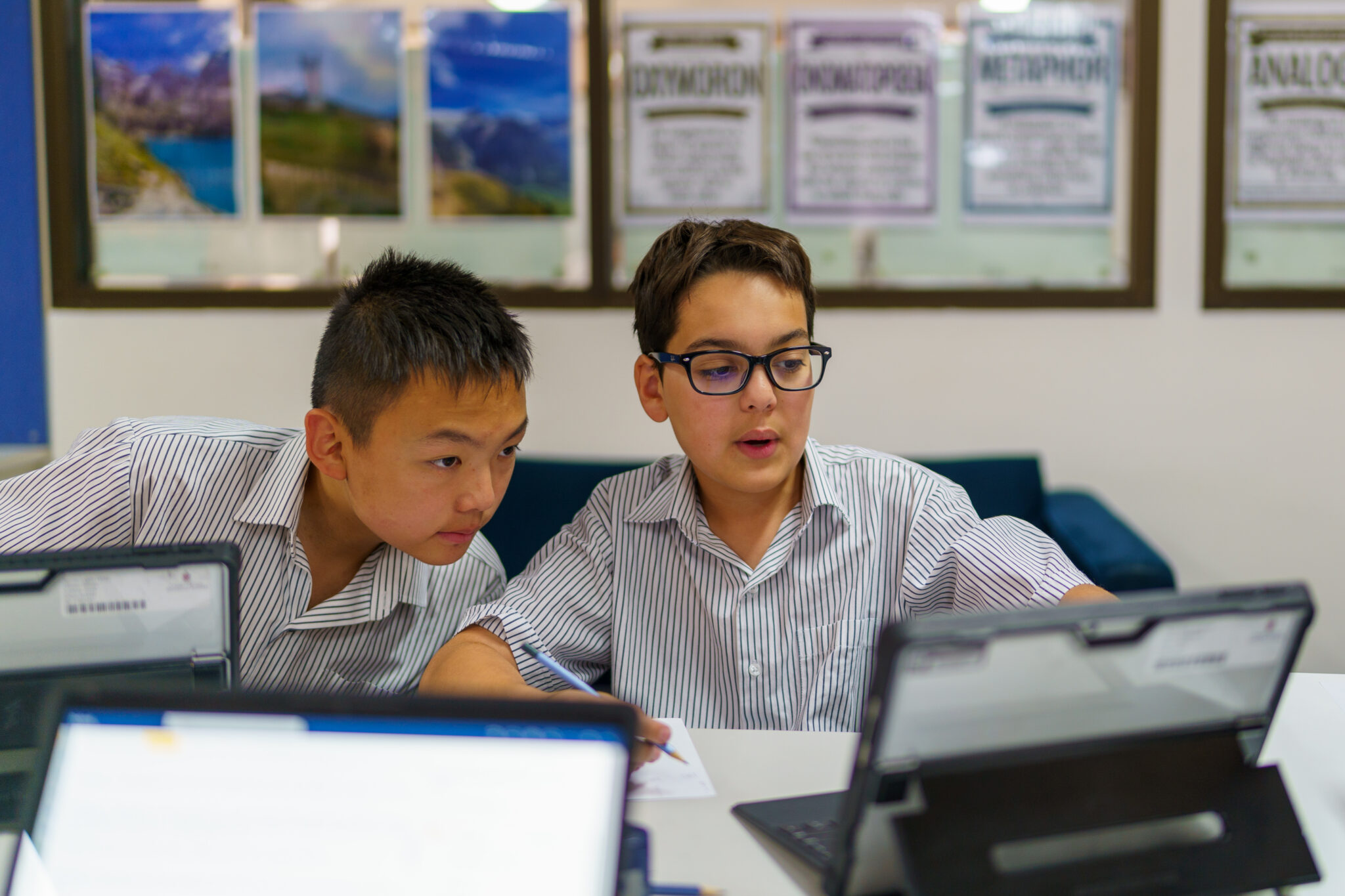 Senior School students working with a Surface Pro laptop