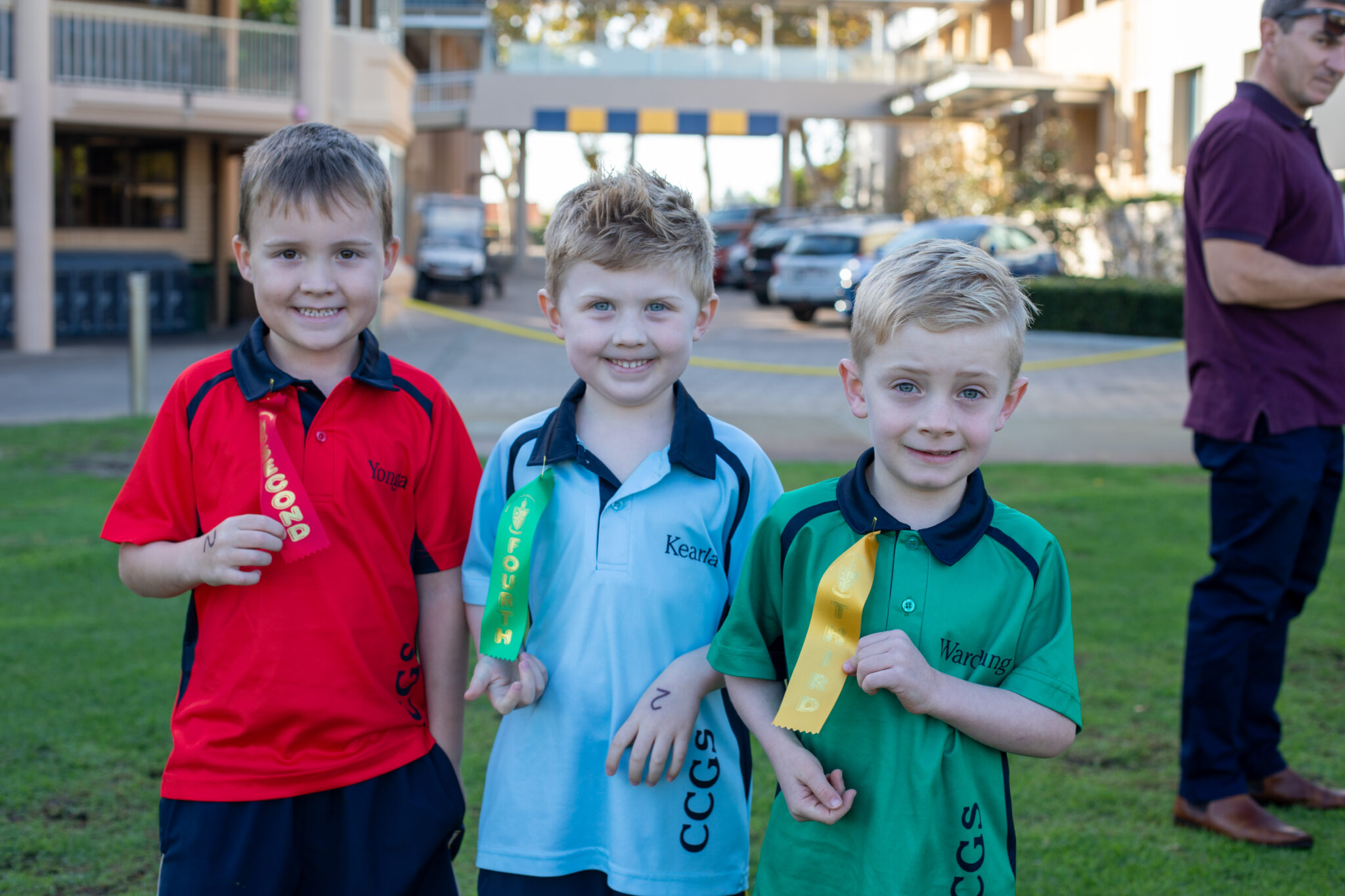 Three Preparatory School students participating in the Pre-Primary to Year 2 Athletics Carnival