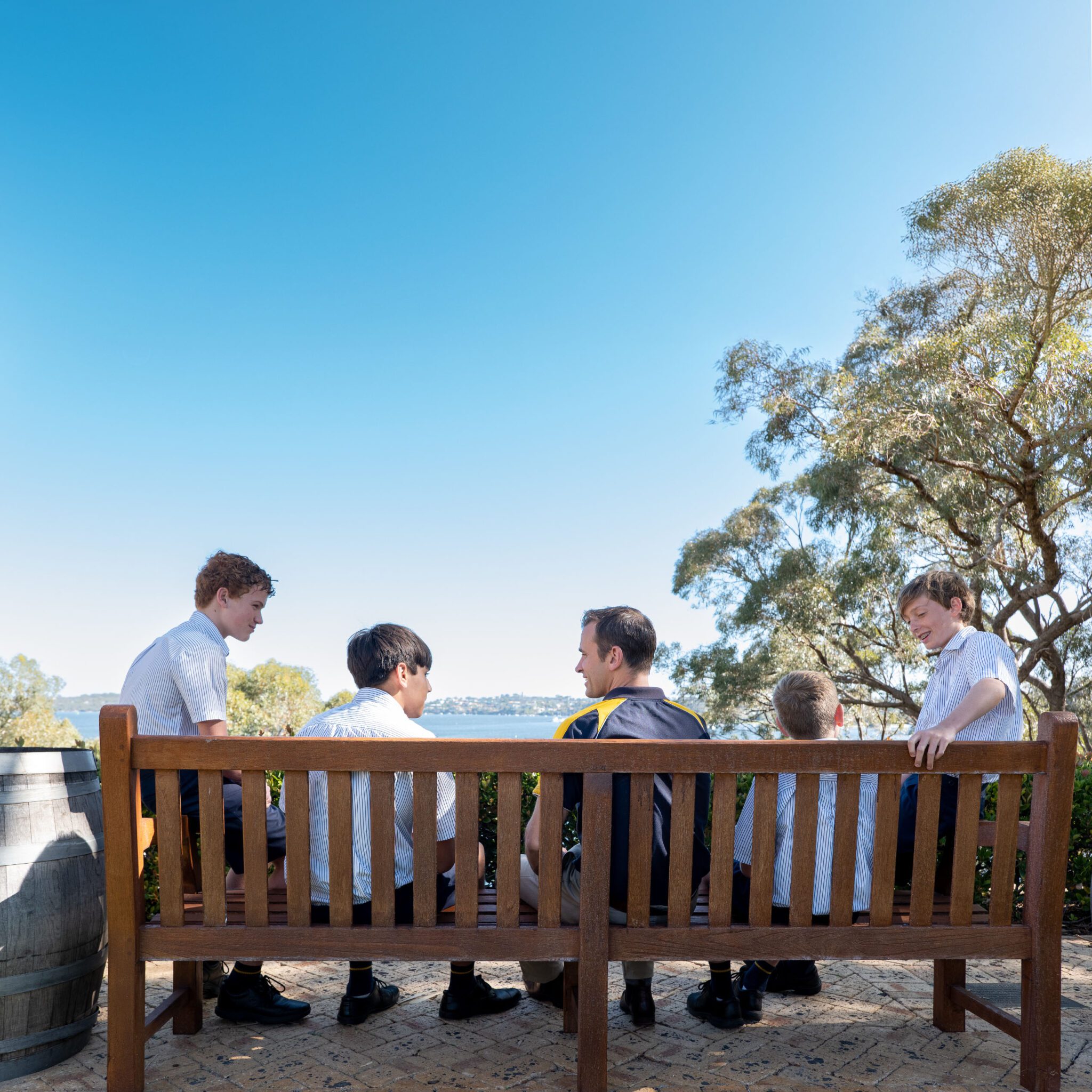 Boarding students overlooking the Swan River having a discussion