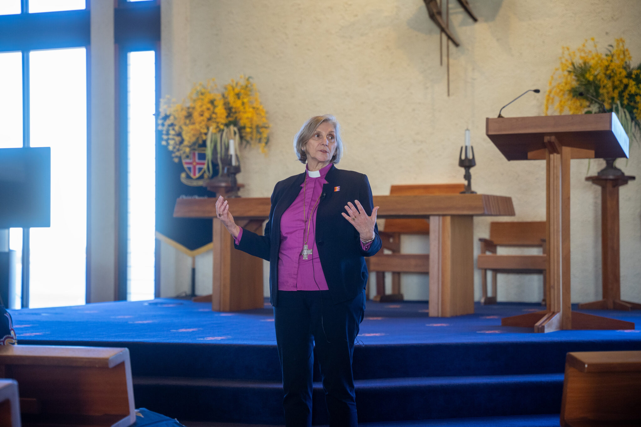 Archbishop Kay Goldsworthy delivering a sermon to an audience in Chapel