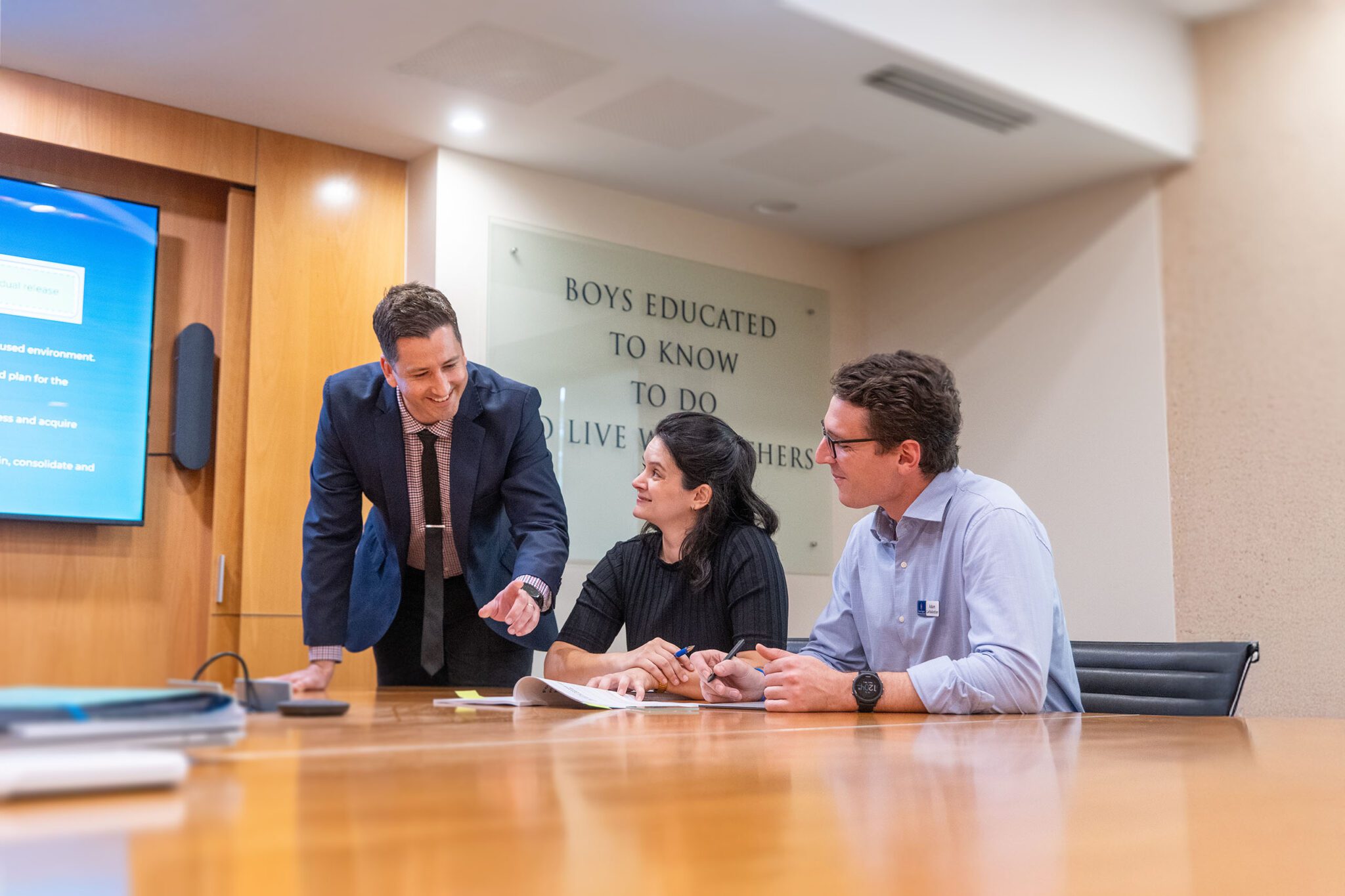 A group of teachers in professional development session having a discussion in a meeting room