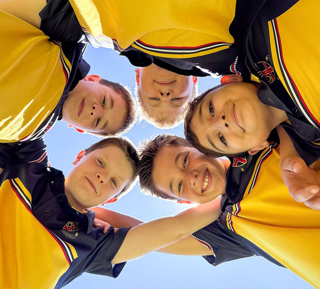 Smiling students gathered in a circle