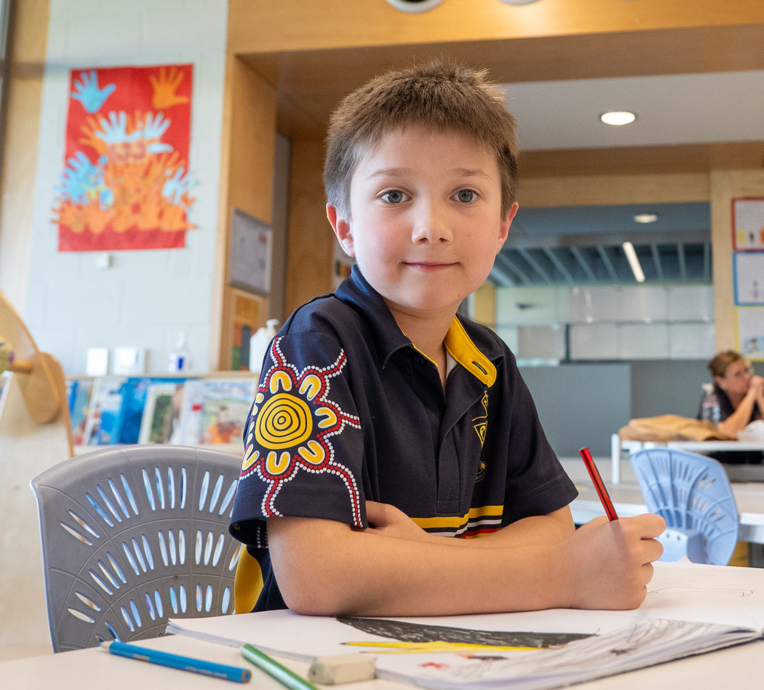 Year 1 student drawing animals in class