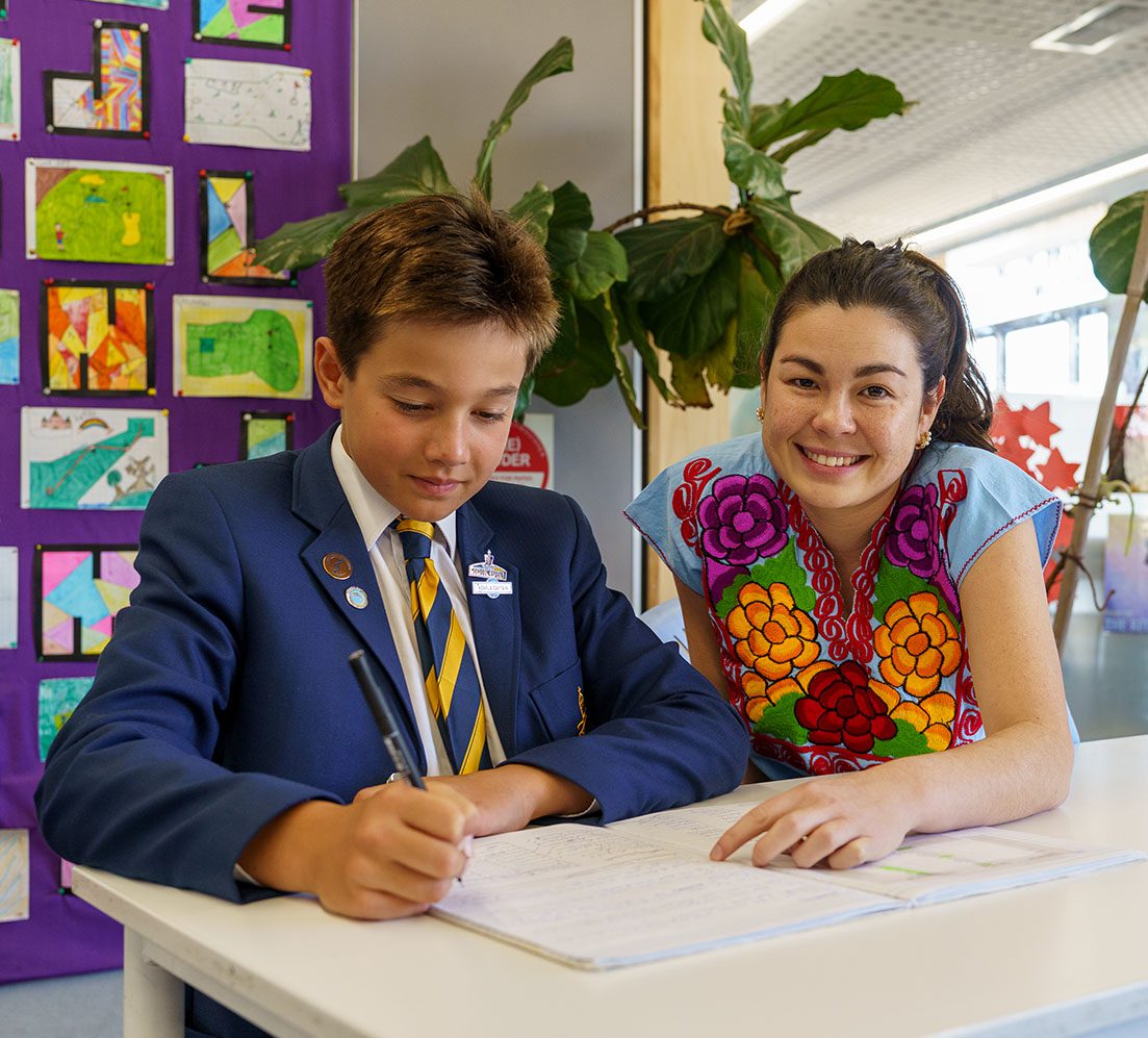 Teacher assisting student during Homework Club