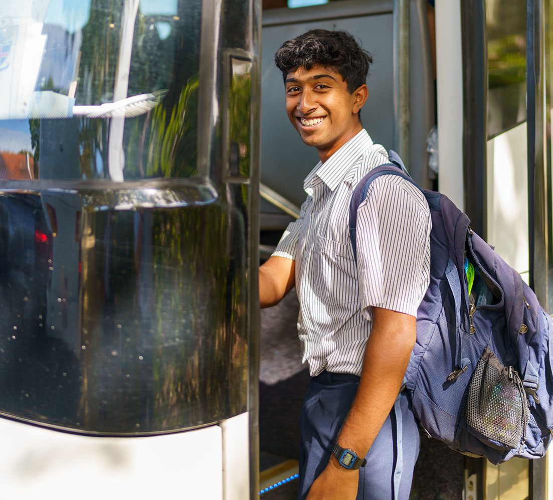 Senior School student boarding a bus