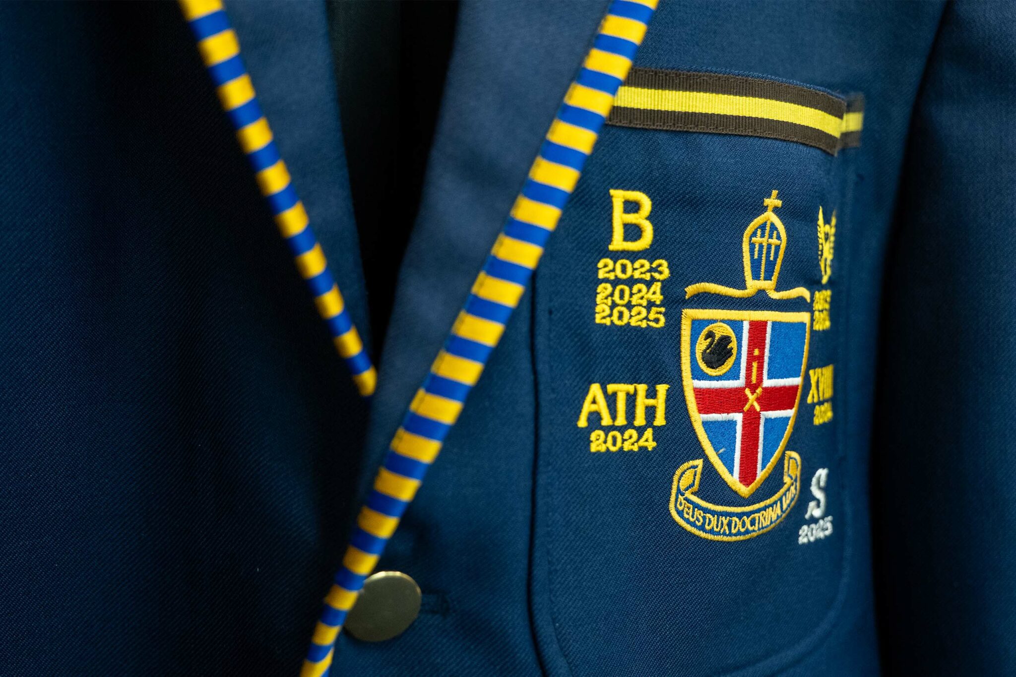 Close up of an embroidered CCGS blazer pocket