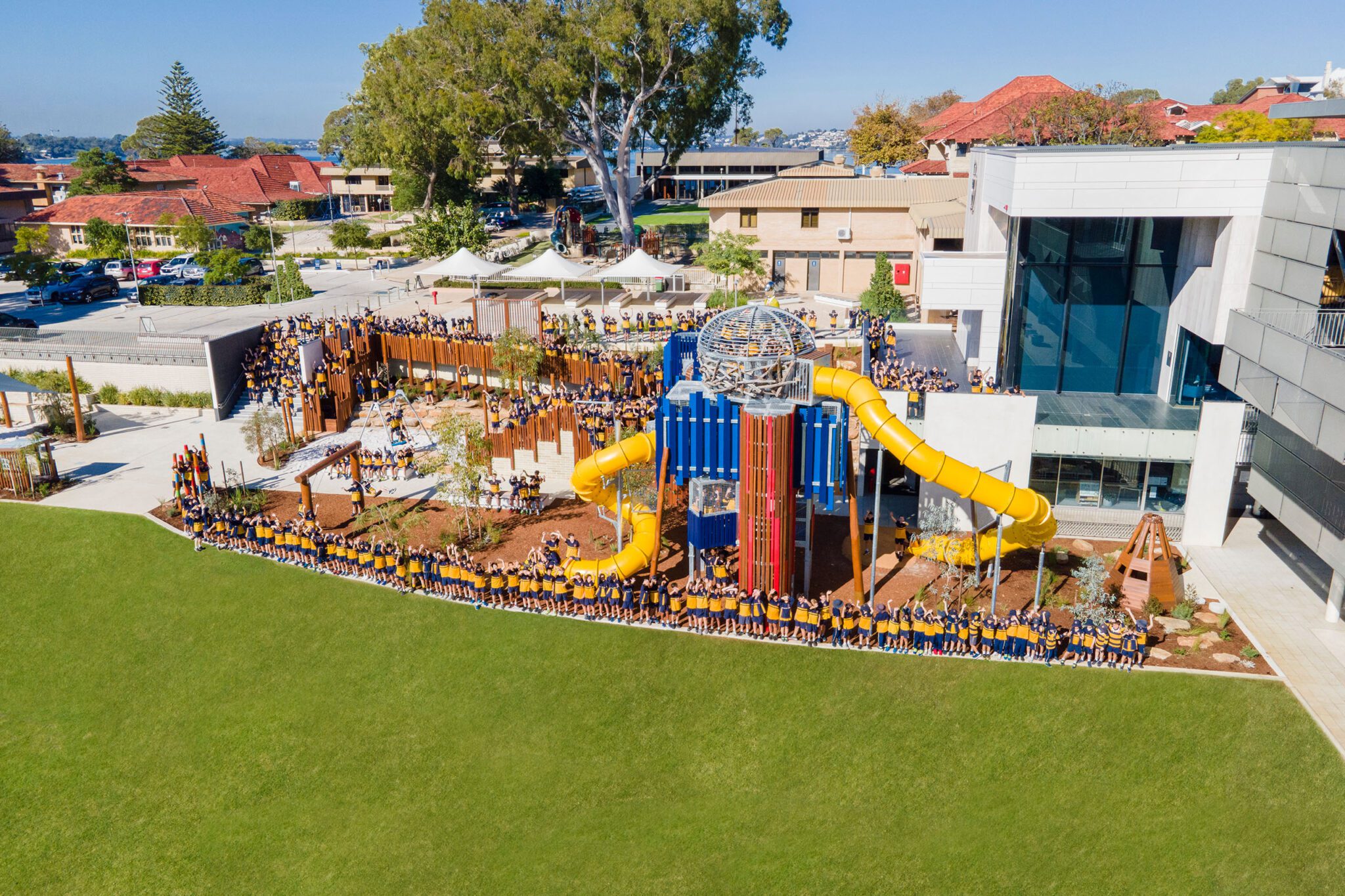 Students crowding around the Nature Playground