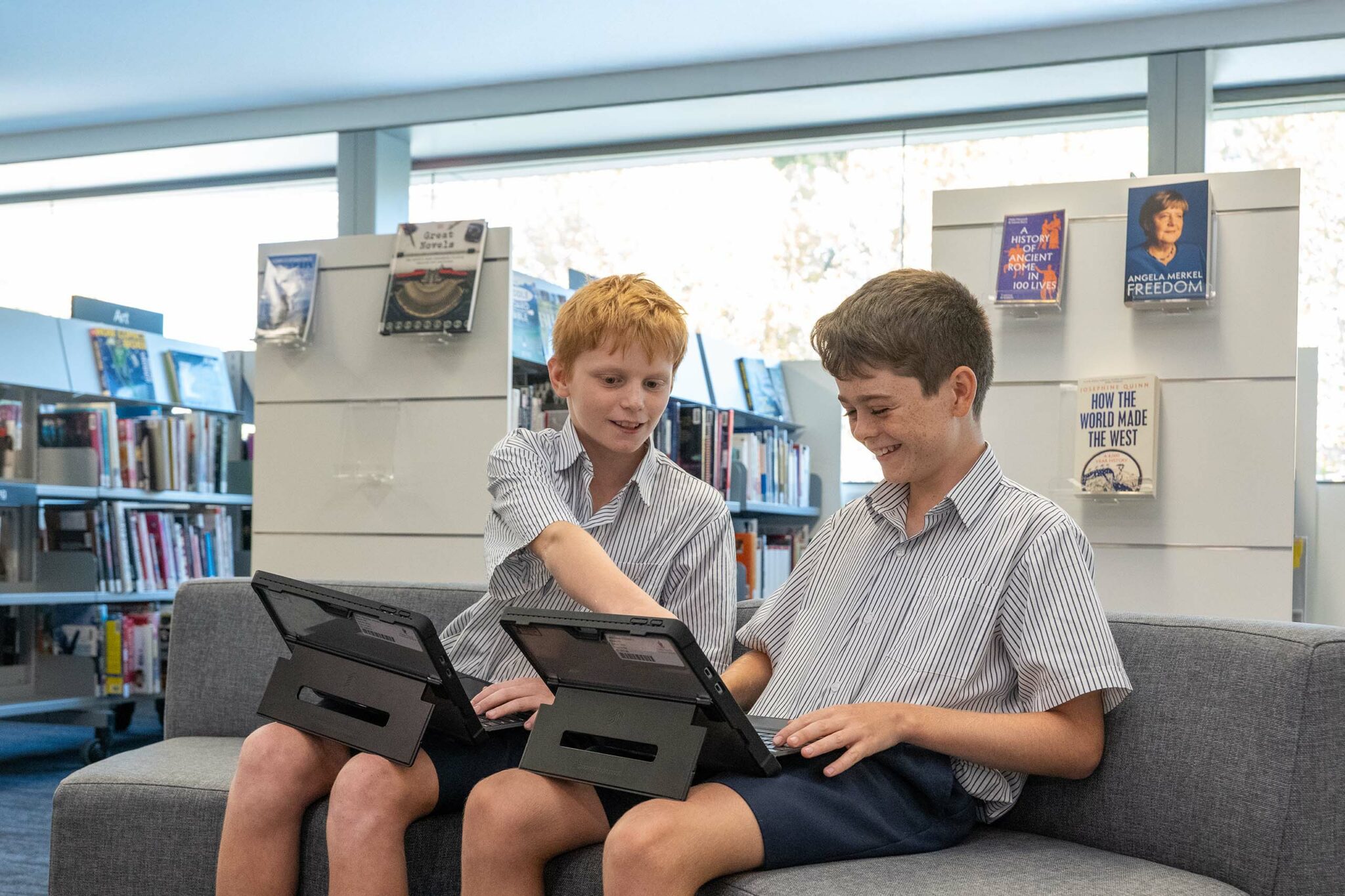 Two Senior School students collaborating in the Academic Resource Centre (ARC) and Library
