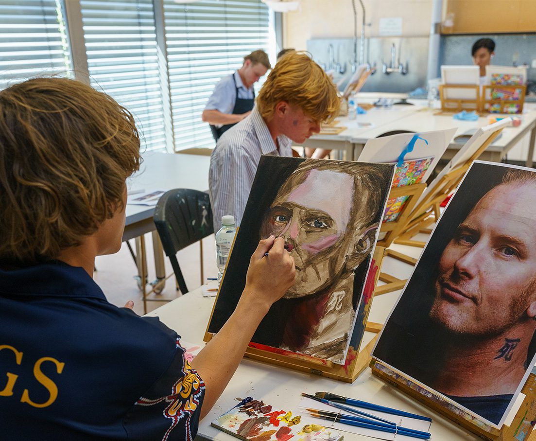 Senior School student painting in Art class