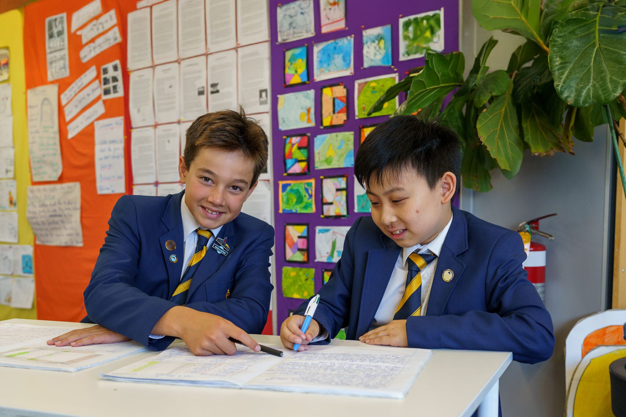 Two Preparatory School students working together in class