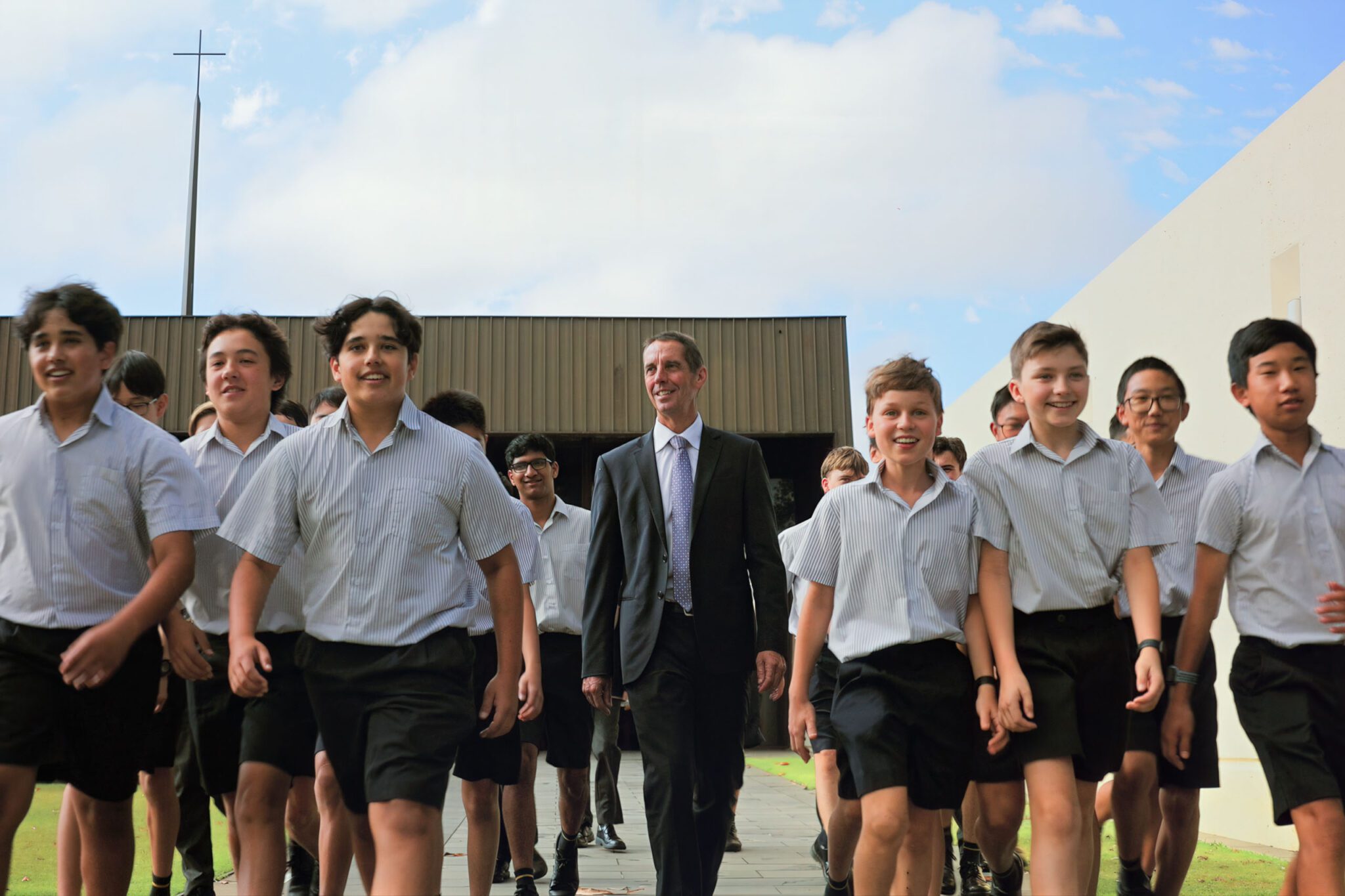 Principal Alan Jones outside Chapel with students