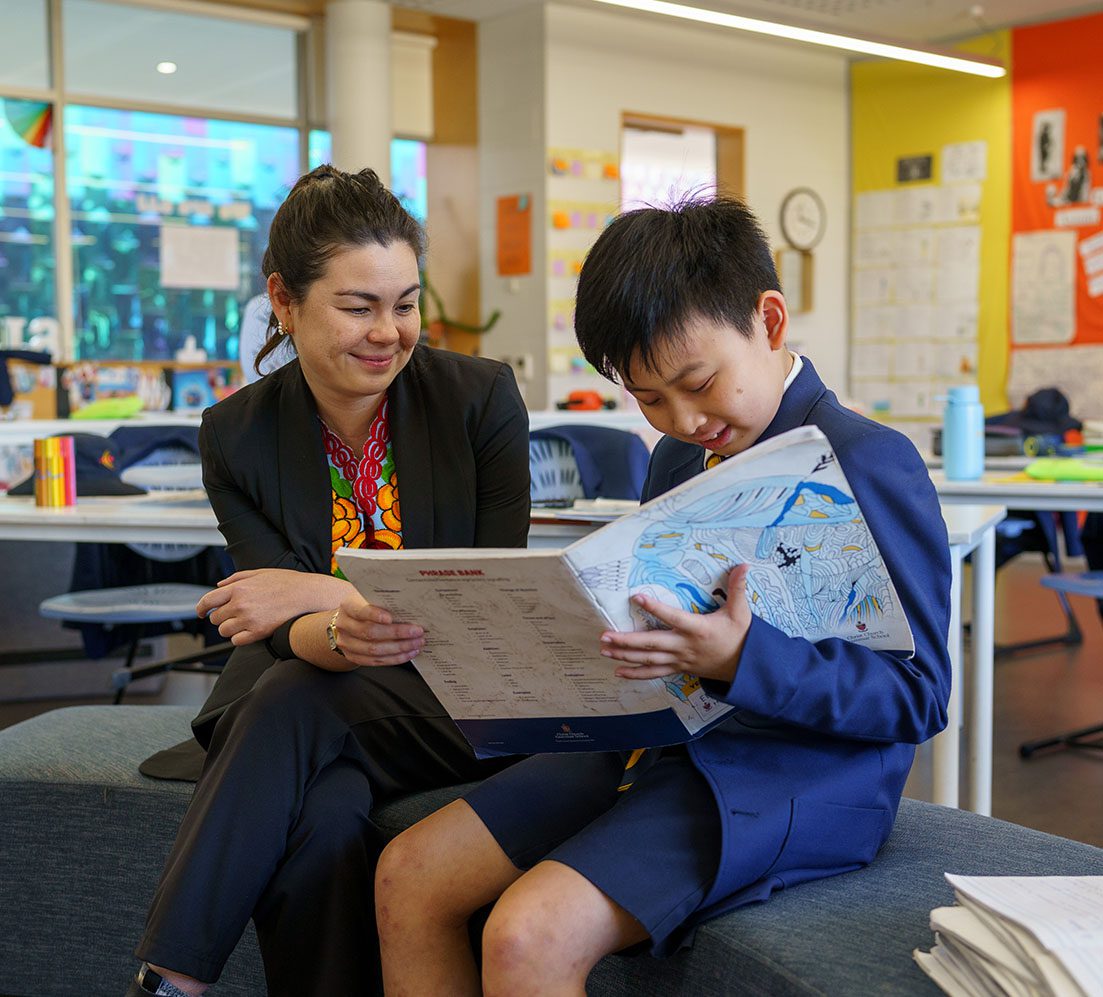 Preparatory School teacher helping a student