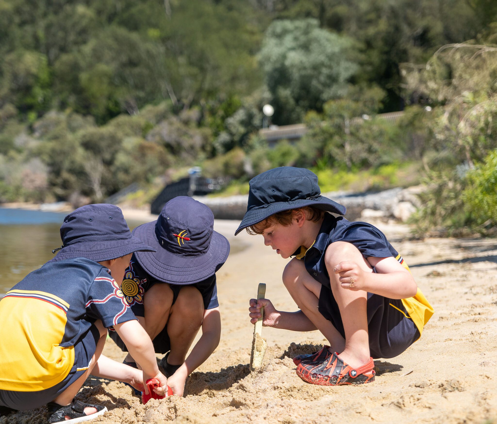 Children playing in the sand at the River Precinct